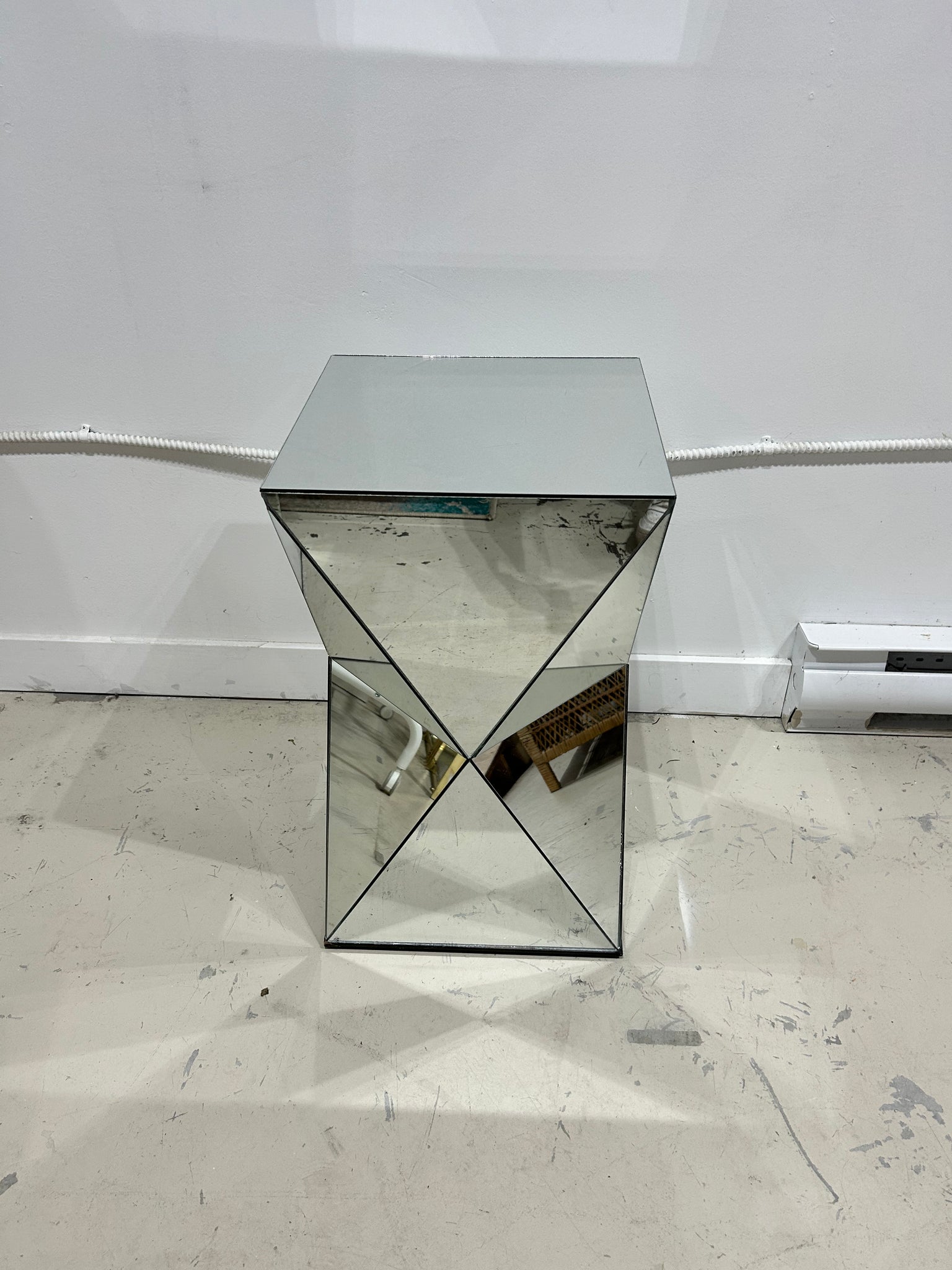 Small triangular mirror podium