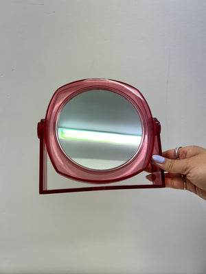 Small plastic fuschia swivel table mirror