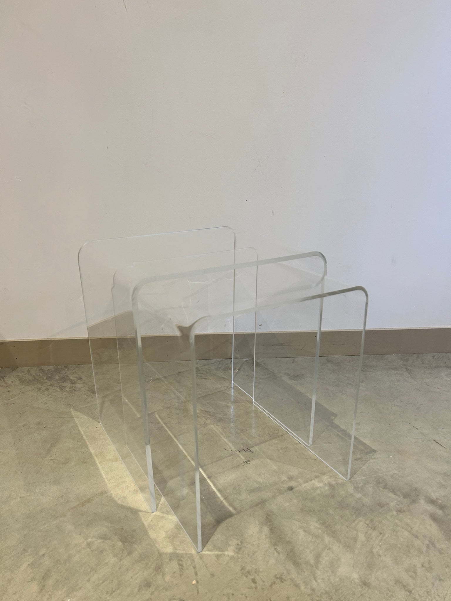 Duo of lucite waterfall nesting side tables