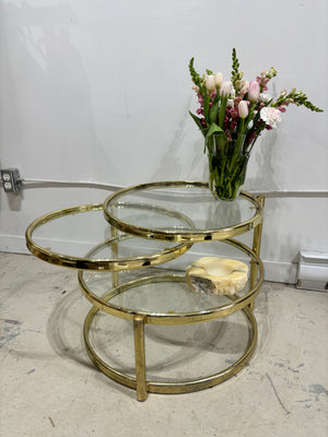 Table à café ronde pivotante en laiton doré et verre