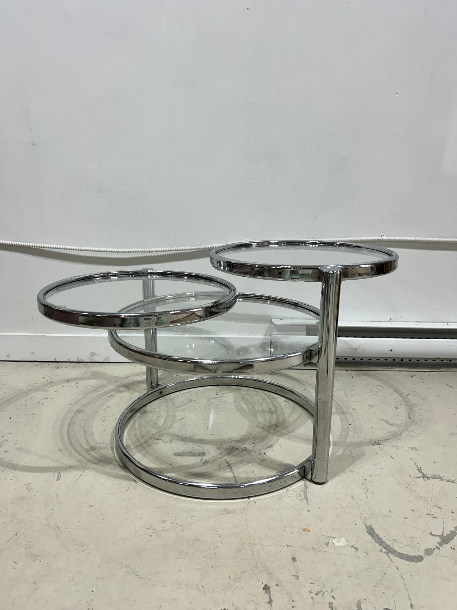 Chrome & glass round swivel coffee table