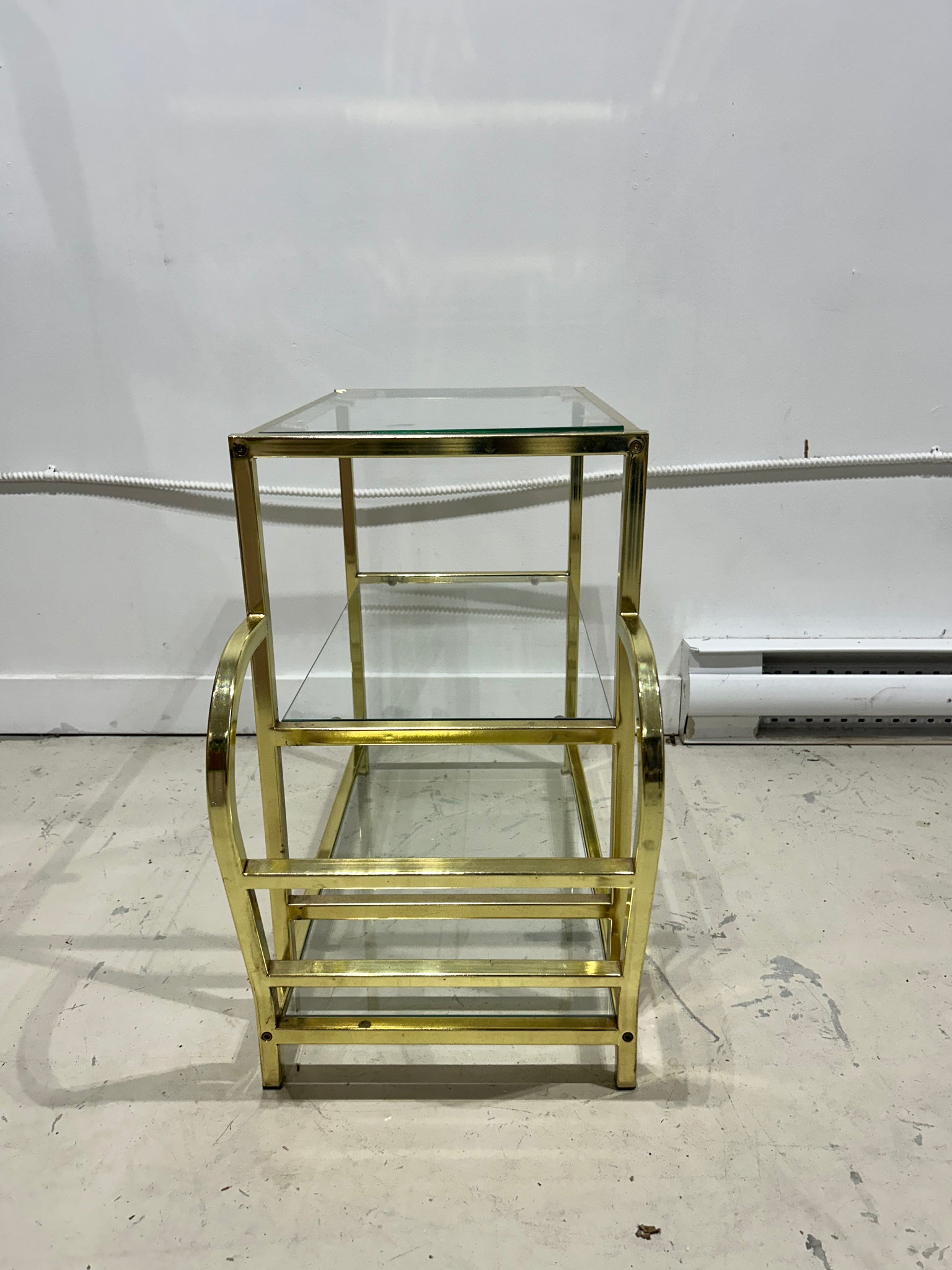 Golden brass side table with literature rack