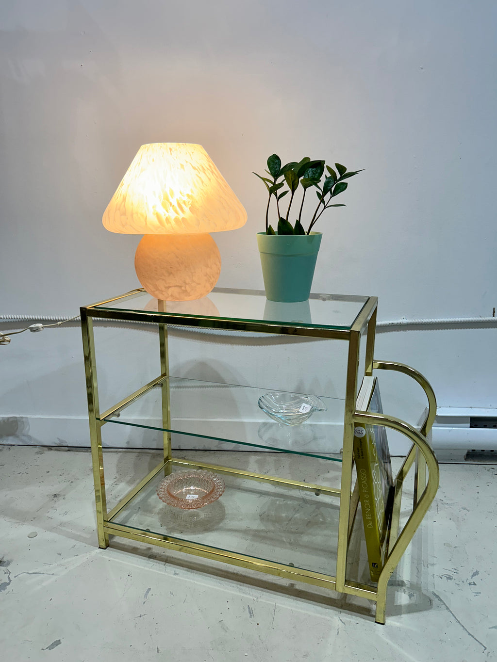 Golden brass side table with literature rack