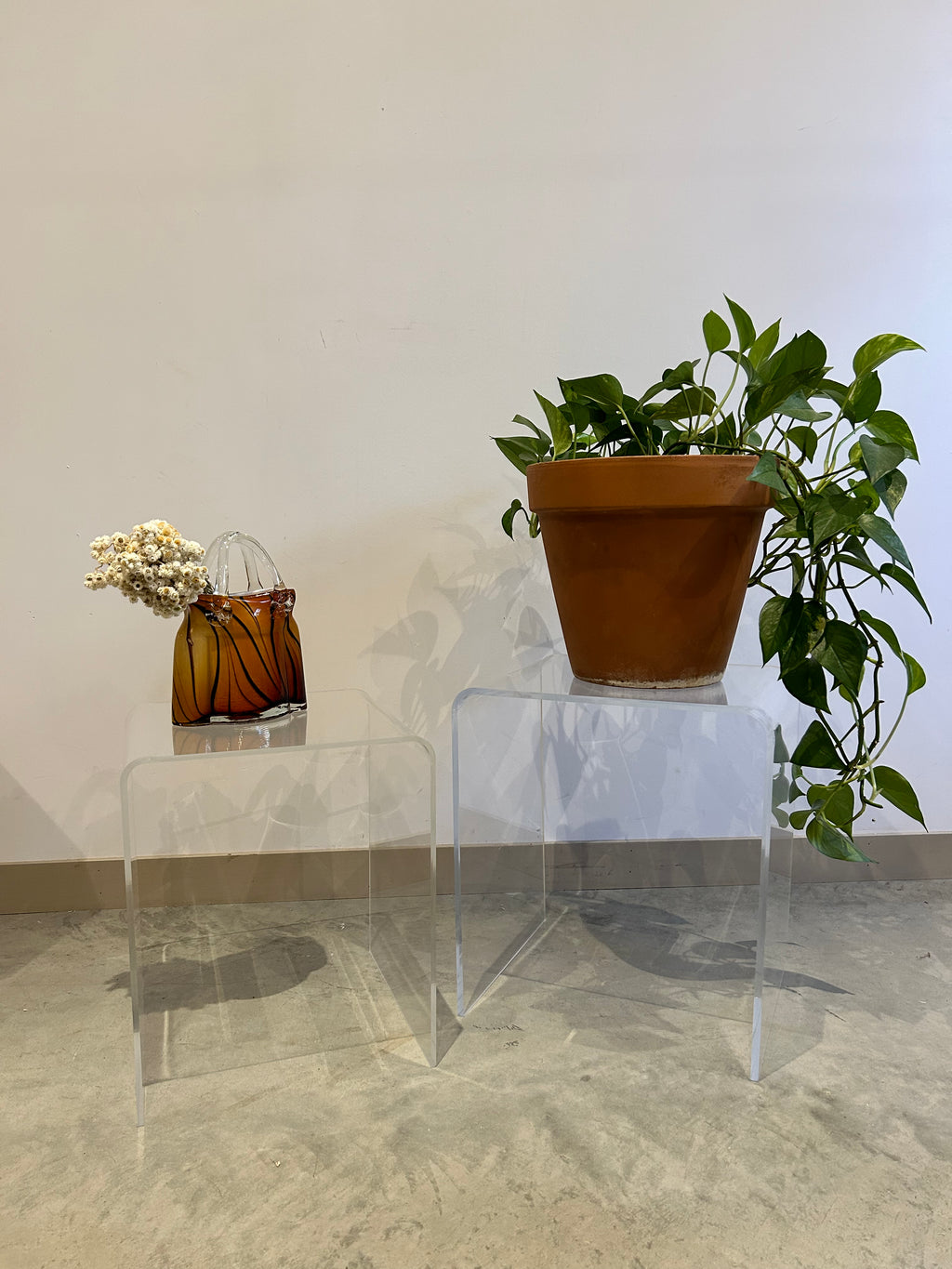 Duo of lucite waterfall nesting side tables