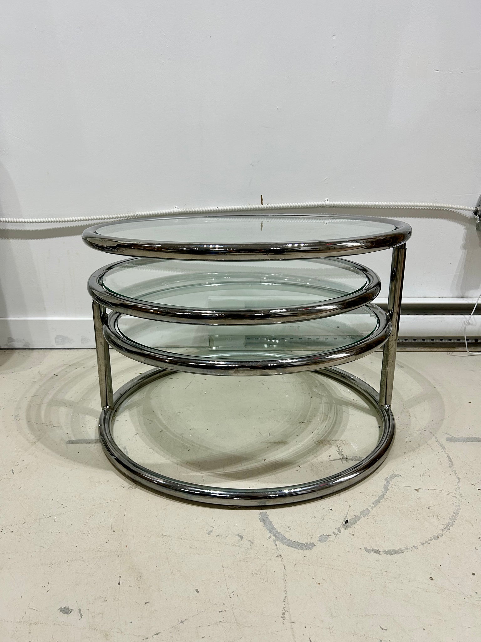 Chrome & glass round swivel coffee table