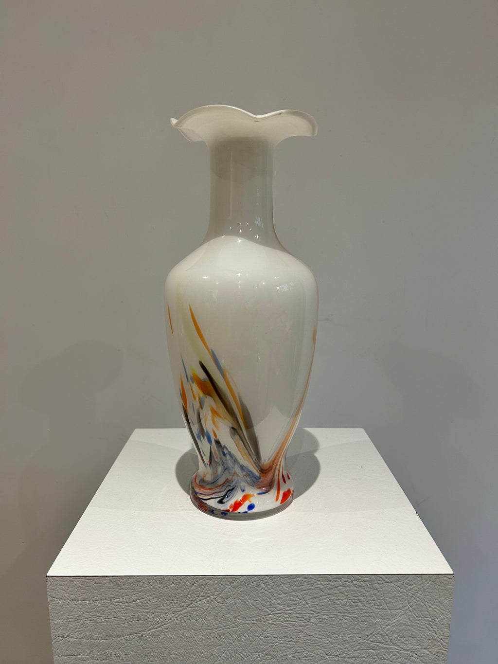 White glass vase with colorful specks