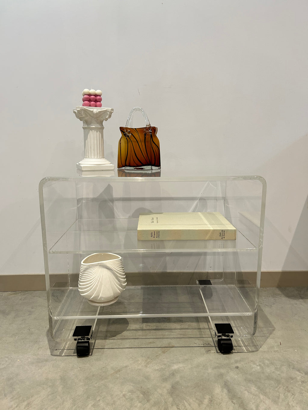 Small lucite coffee / side table on wheels