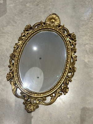 Ornate golden Syroco mirror