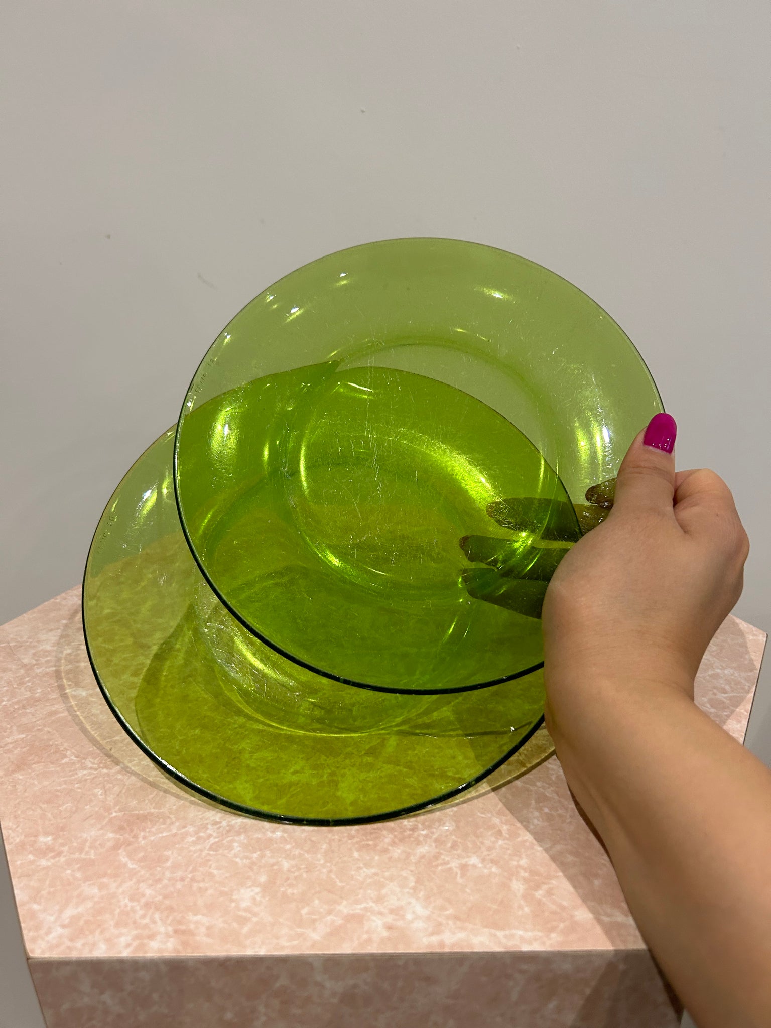Selection of green glass plates and bowls