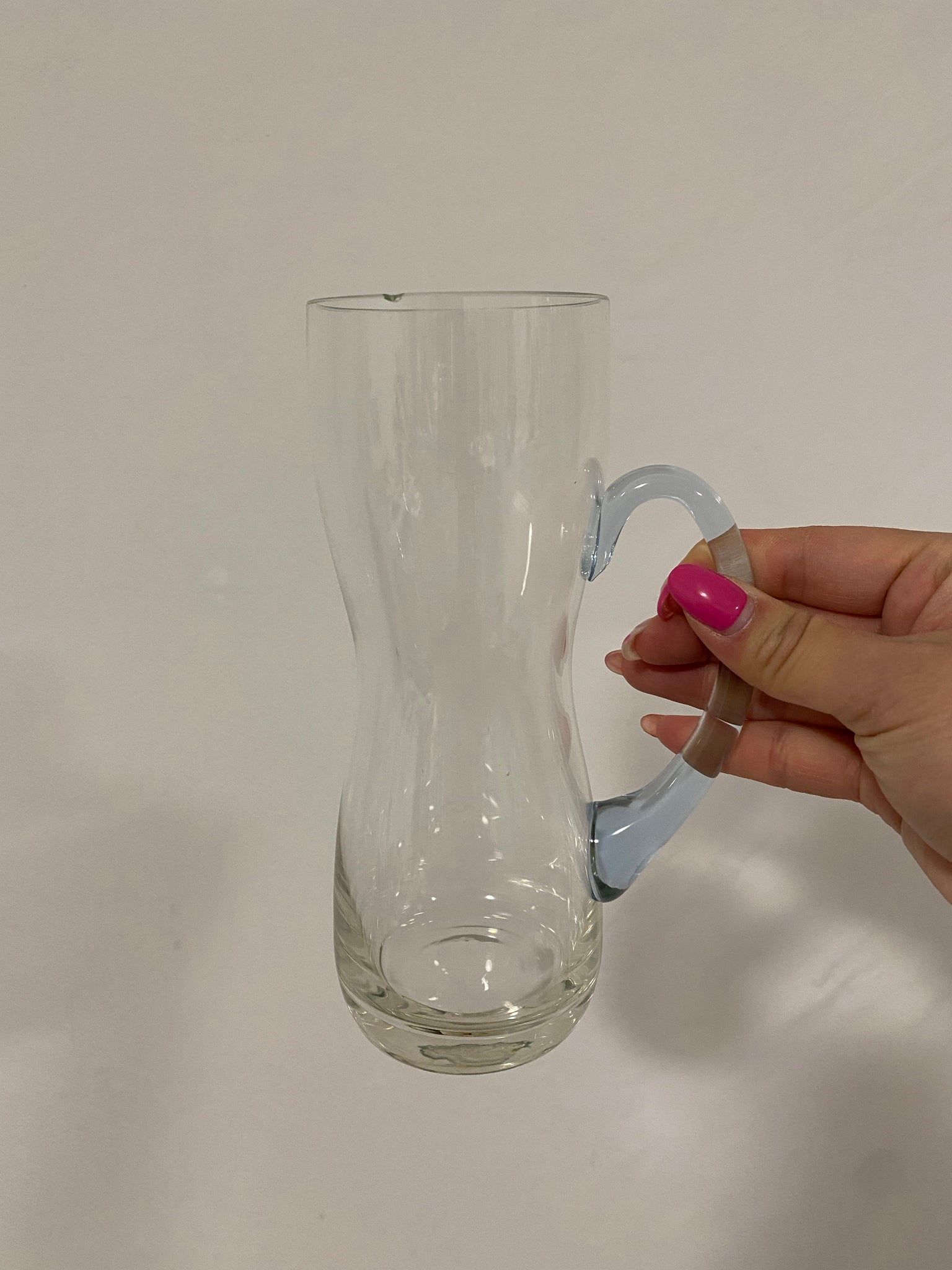 Tall glass mugs with colorful handles