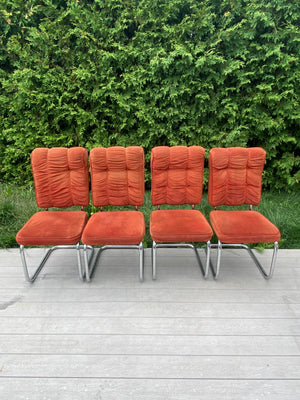 Burnt orange velour & chrome cantilever chairs