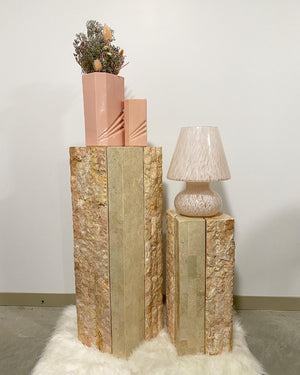 Pink tesselated stone podiums