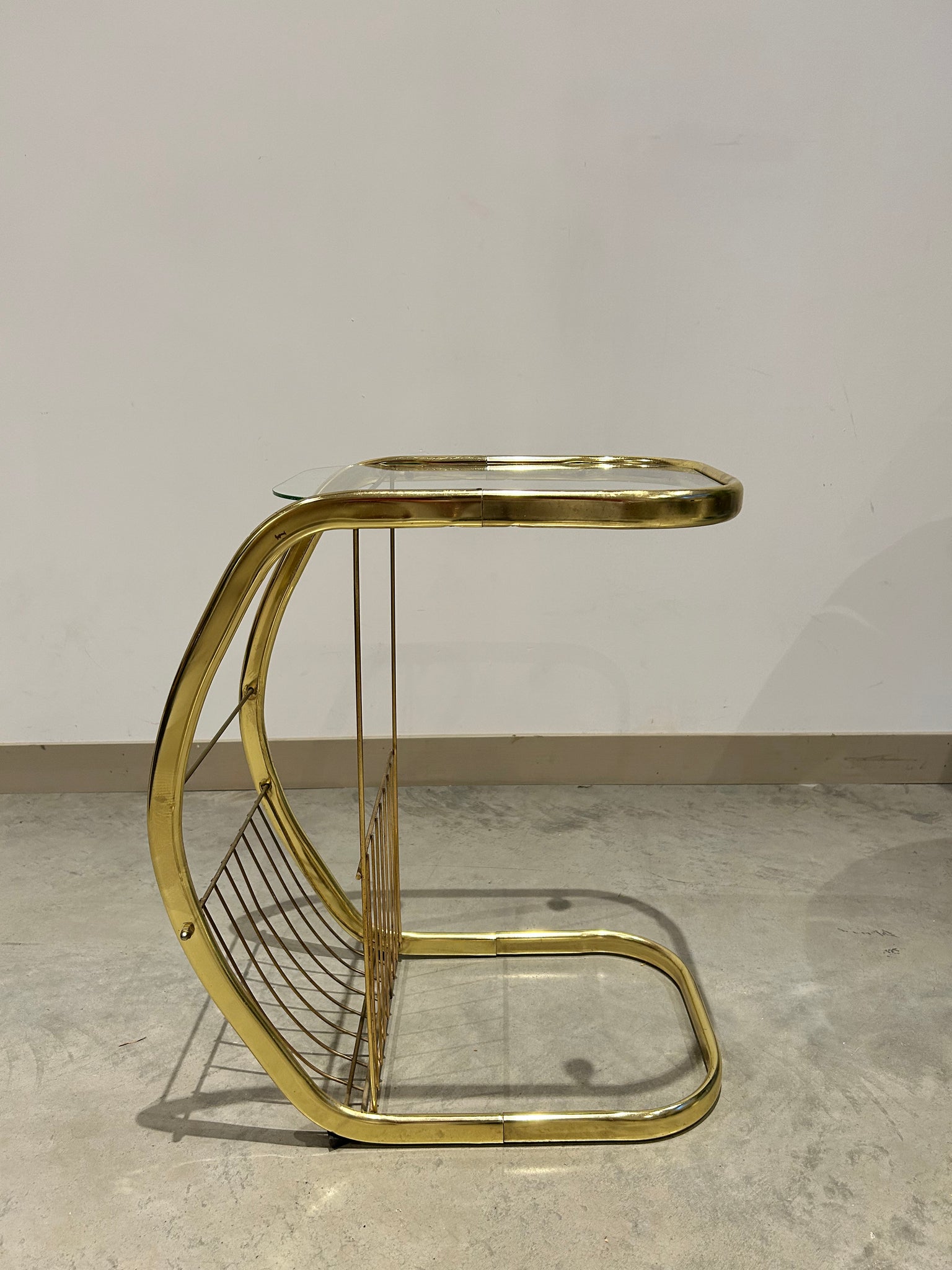 C golden brass side table with literature rack