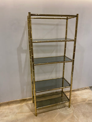 Tall golden brass shelf
