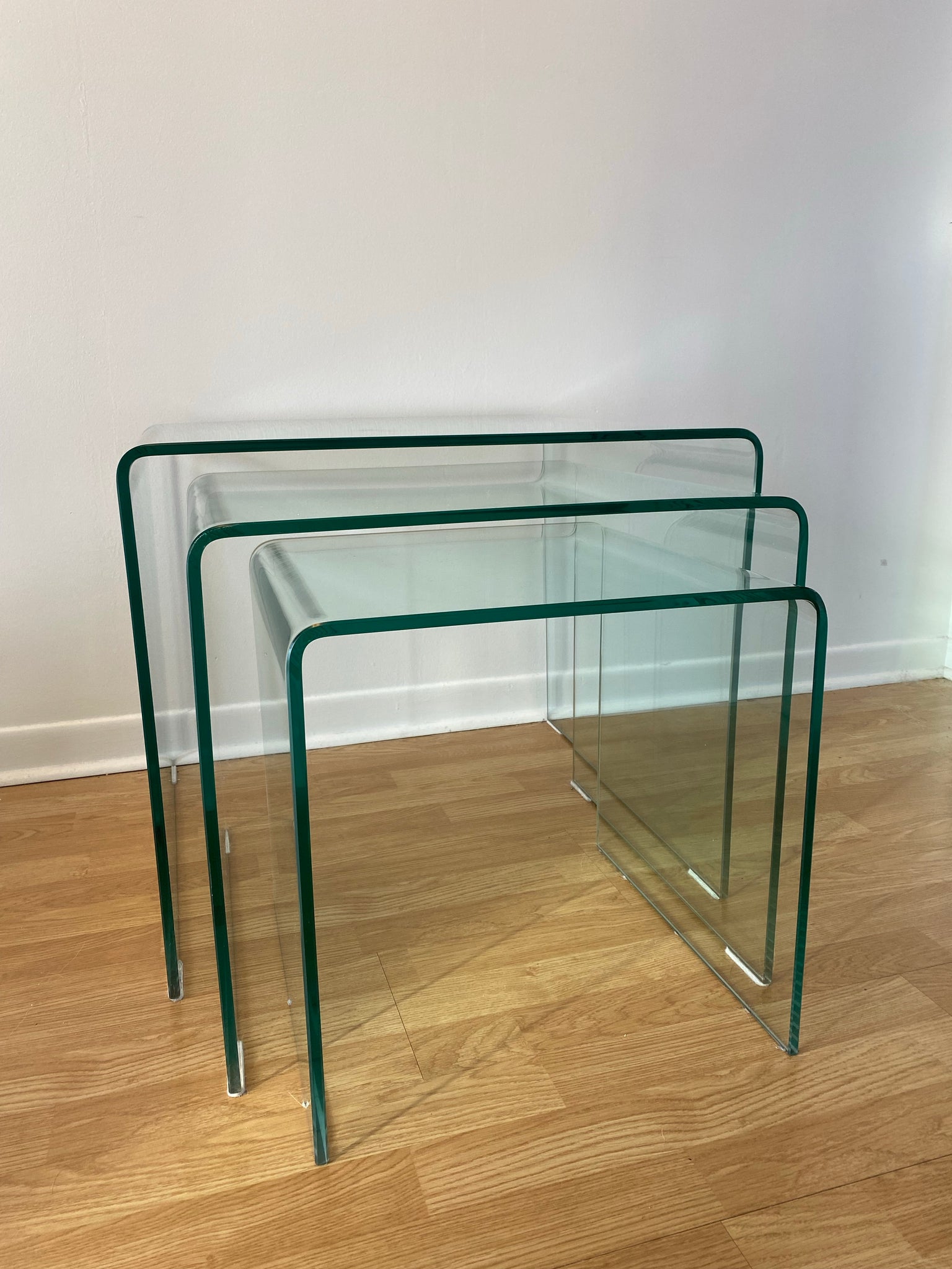 Trio of large tempered glass waterfall nesting side tables