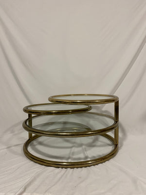Golden brass & glass round swivel coffee table
