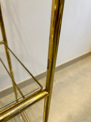 Golden brass arched metal shelf