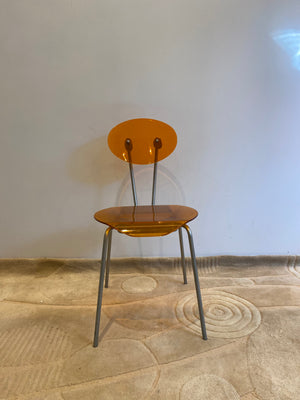 Orange lucite & metal chairs