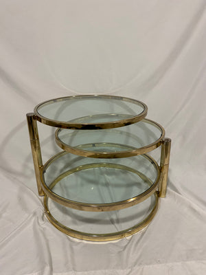 Golden brass & glass round swivel coffee table