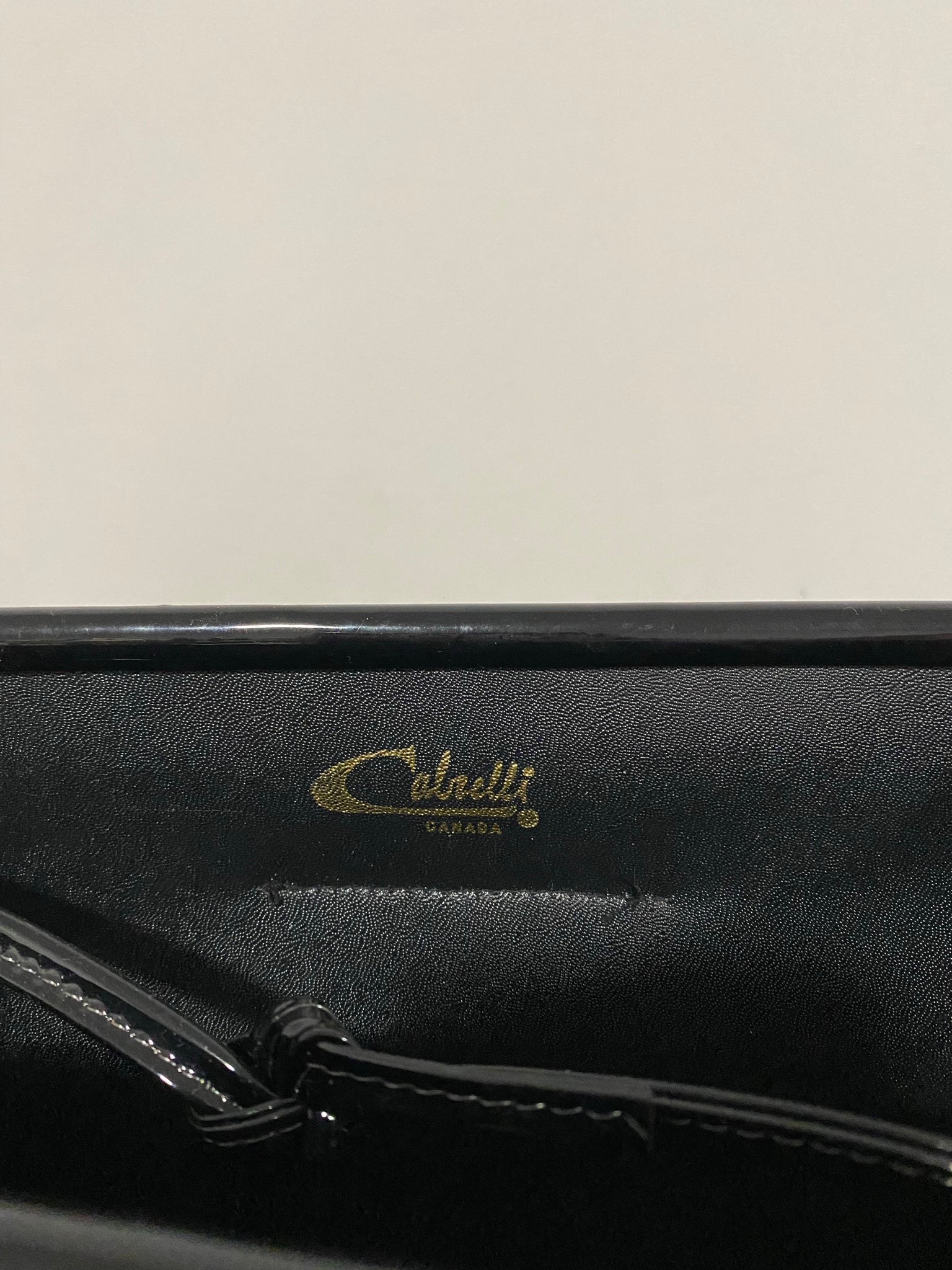 Black patent leather purse and clutch with leather details