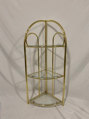 Small golden brass corner shelf