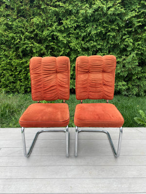 Burnt orange velour & chrome cantilever chairs