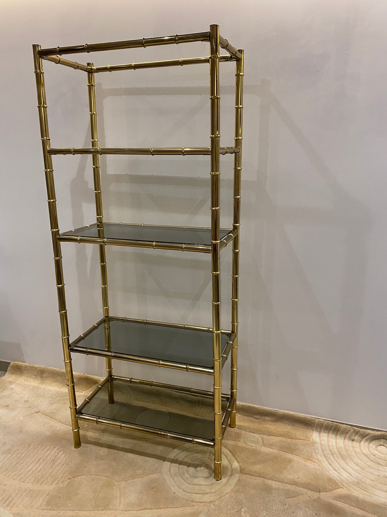 Tall golden brass shelf