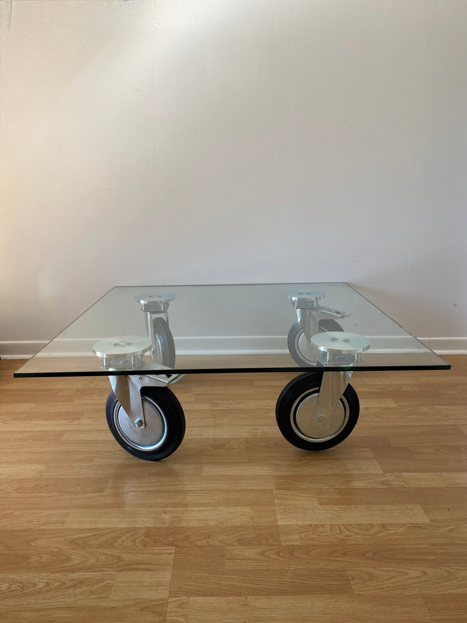 Gae Aulenti Fontana Arte style tempered glass coffee table on wheels