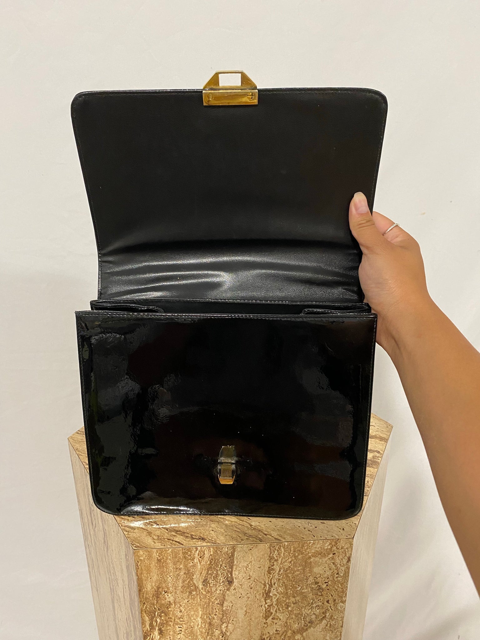 Black patent leather handbag