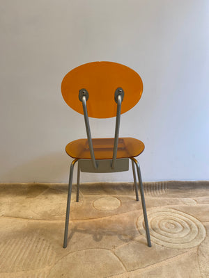 Orange lucite & metal chairs
