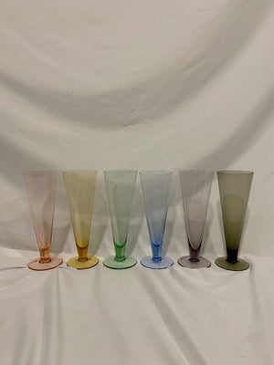 Rainbow of tall colorful glasses