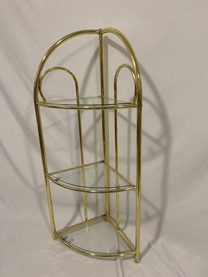 Small golden brass corner shelf