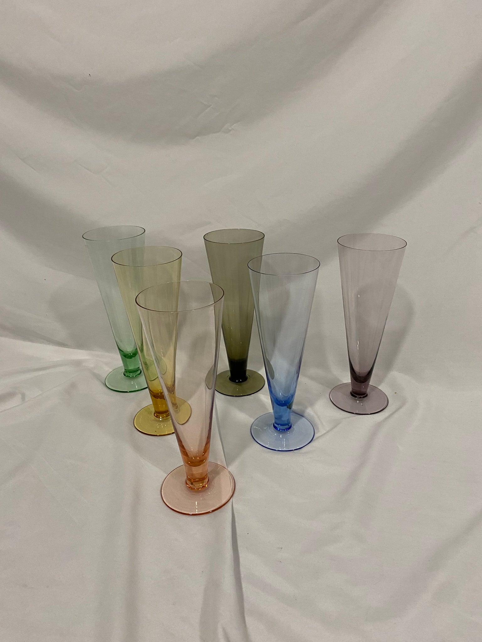 Rainbow of tall colorful glasses