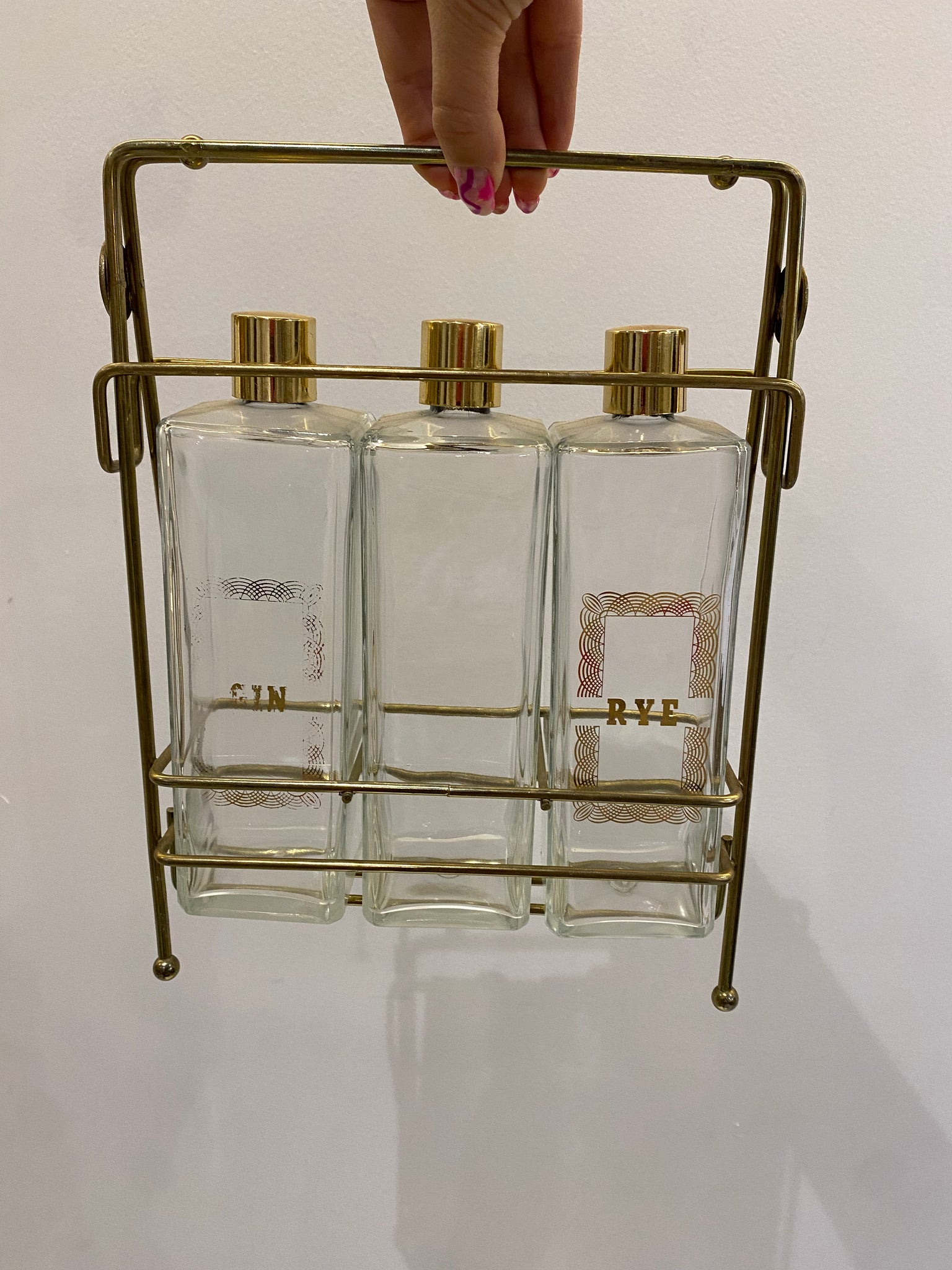 Liquor bottles & brass rack