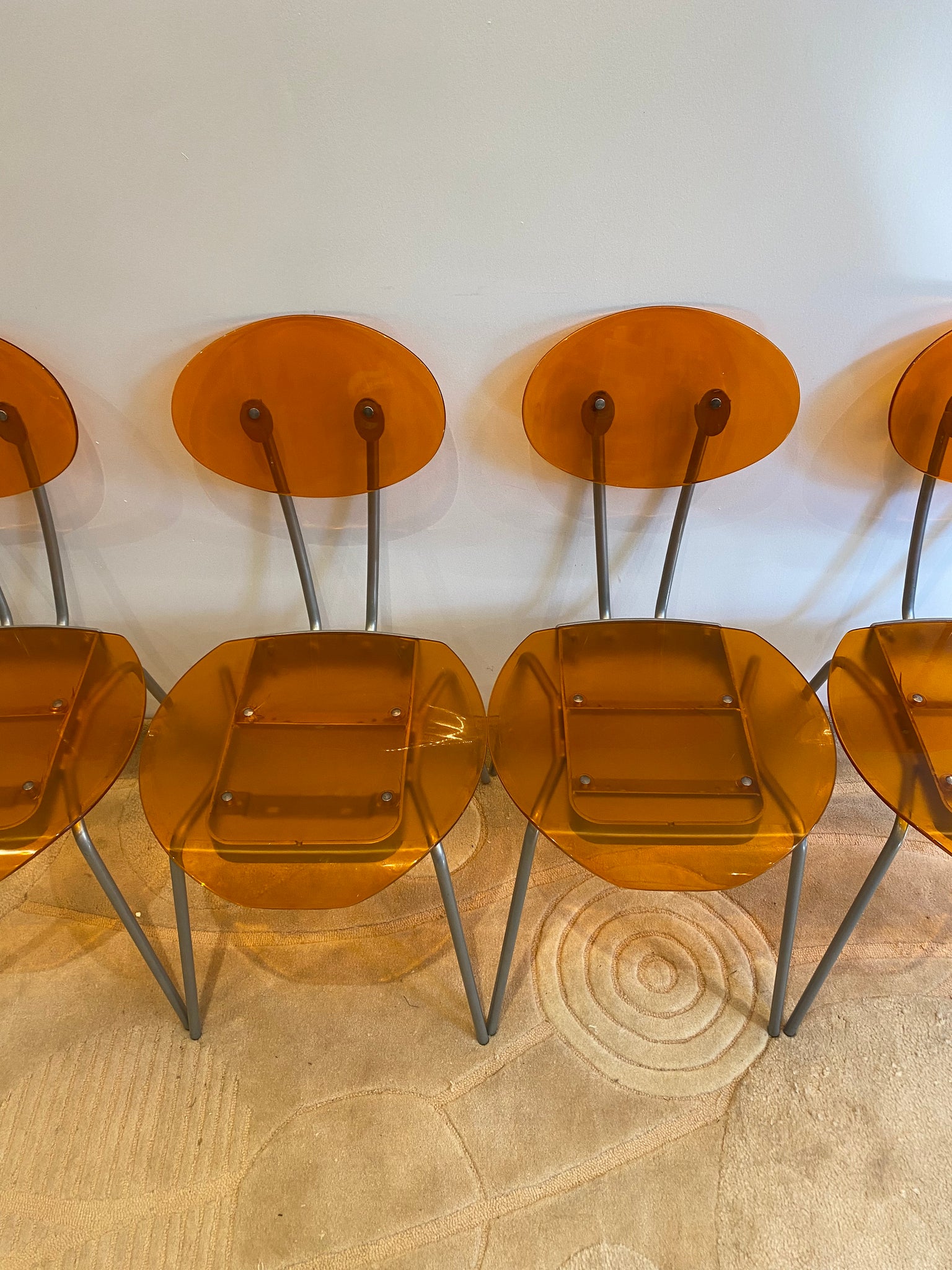 Orange lucite & metal chairs