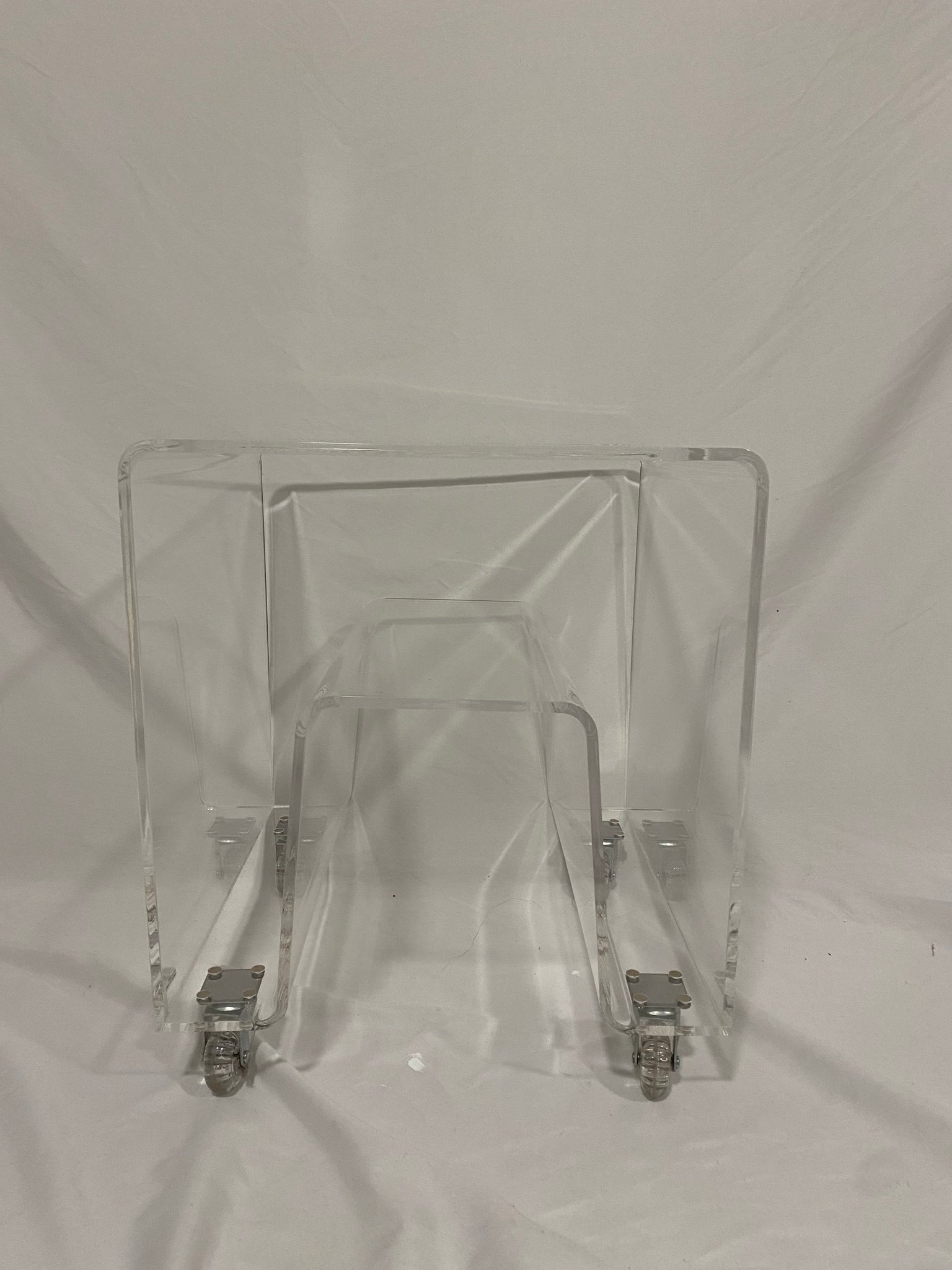 Small lucite table on wheels