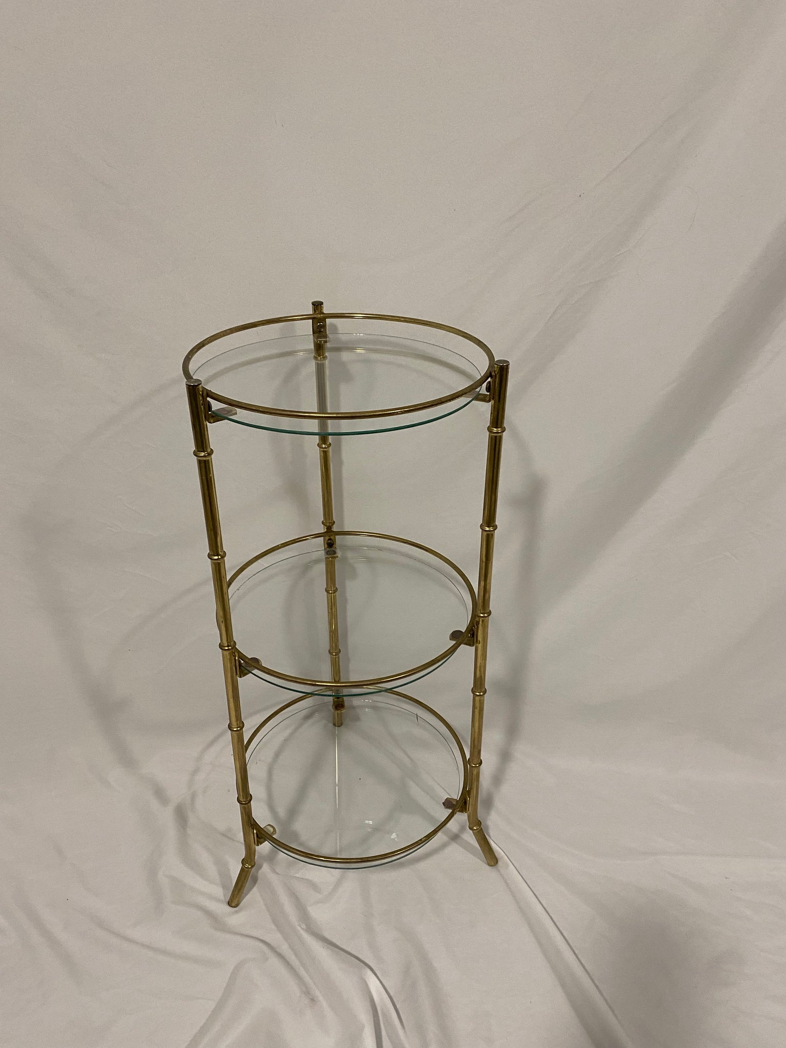 Small cylindrical brass & glass table / shelf