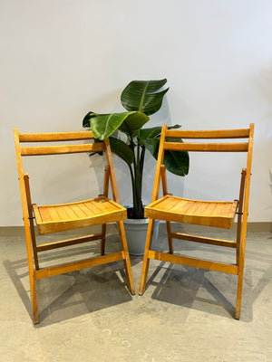 Pair of wooden folding chairs