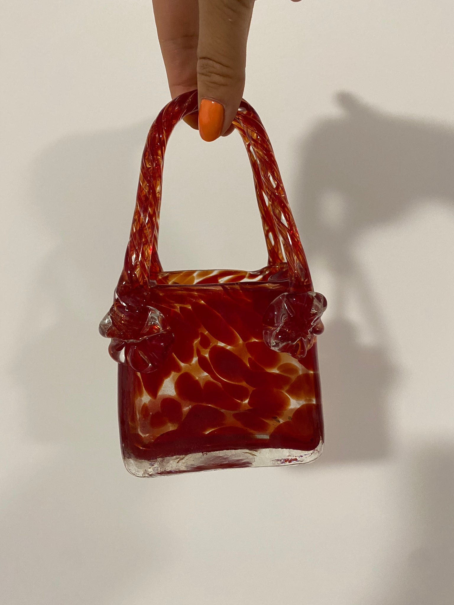Small red Murano style glass purse vase