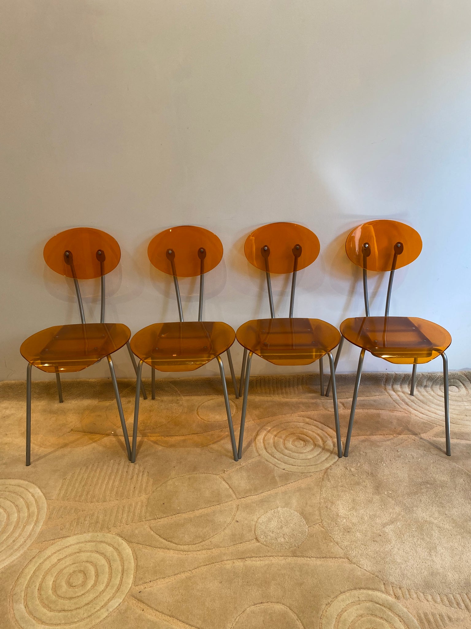 Orange lucite & metal chairs