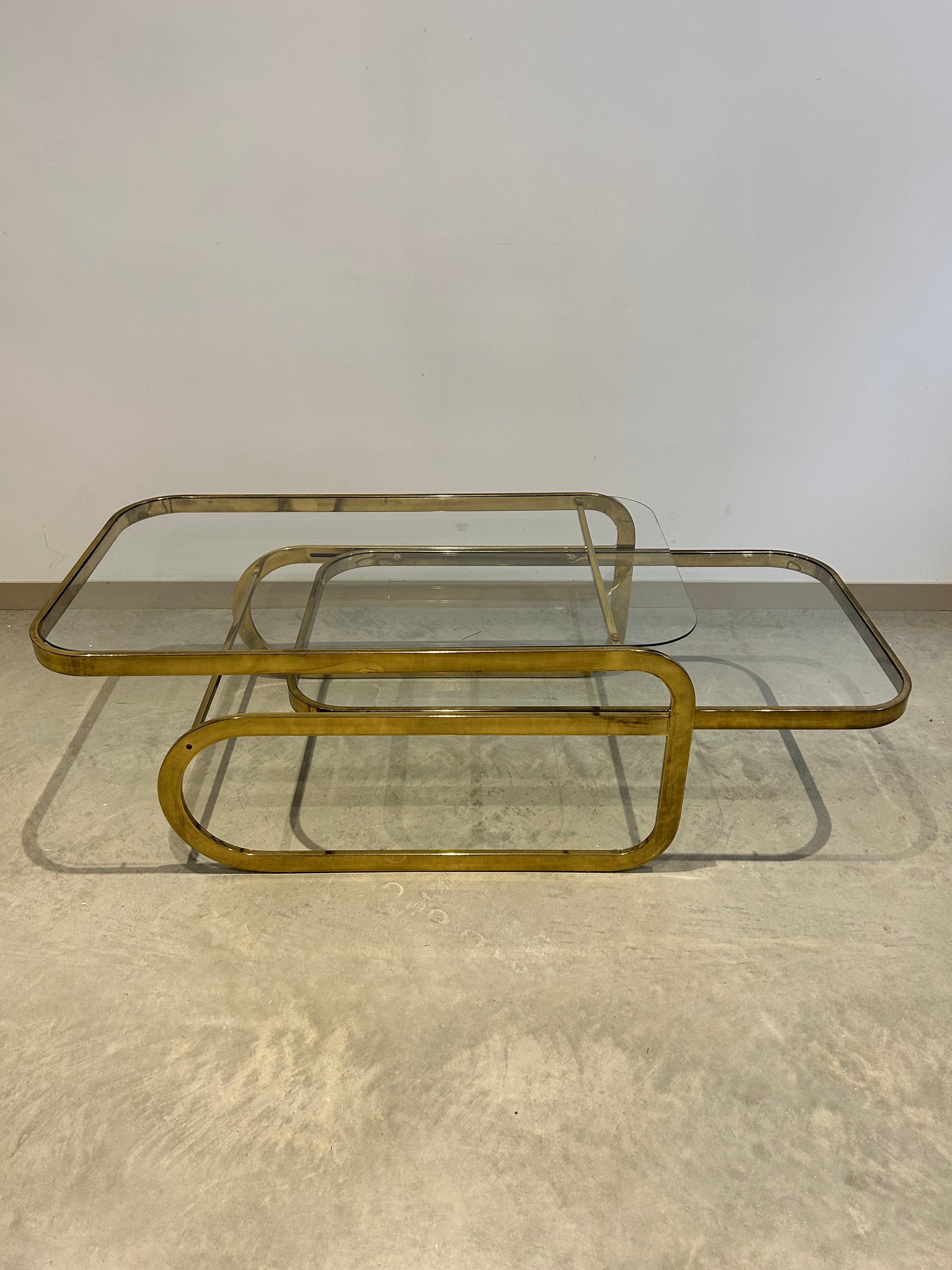 Golden brass sliding rectangular coffee table
