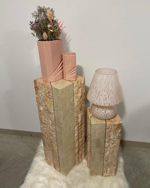 Pink tesselated stone podiums