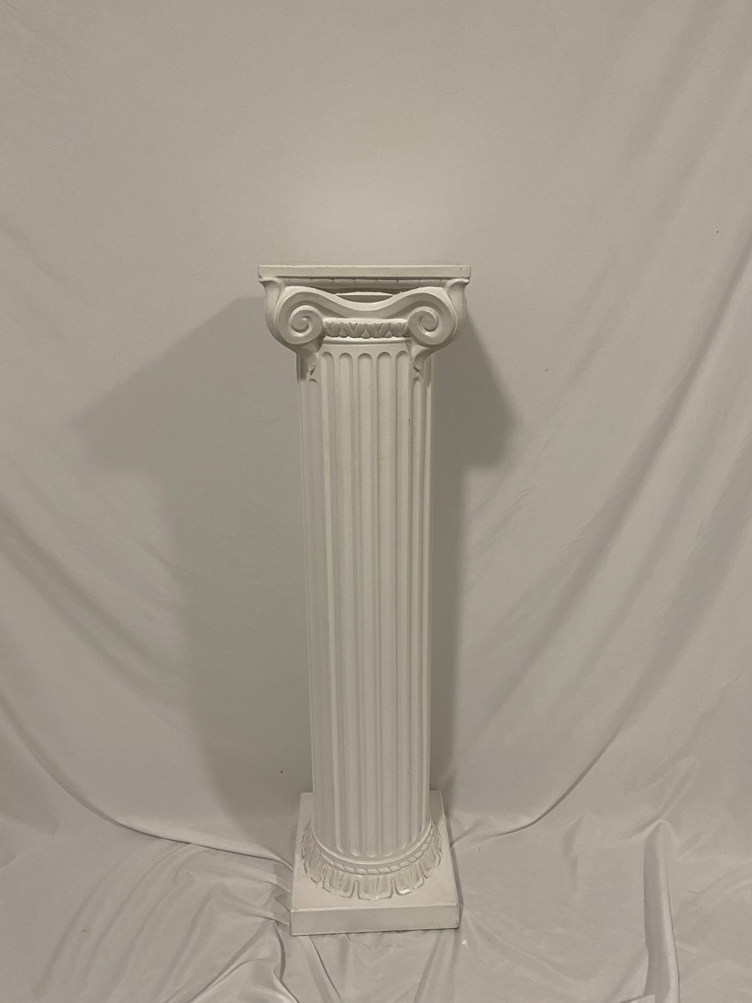 Tall plaster column