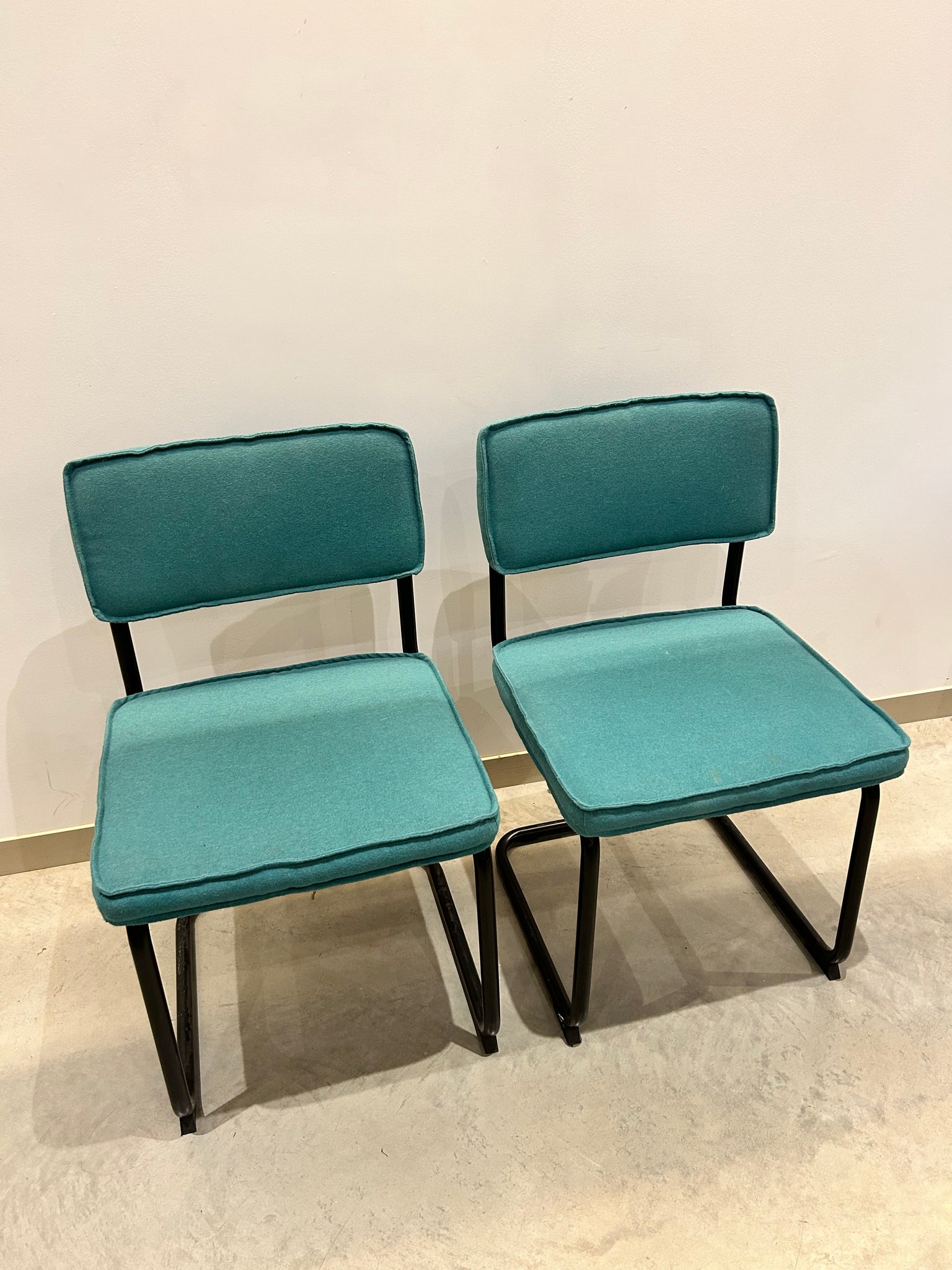Teal felt & black metal cantilever chairs