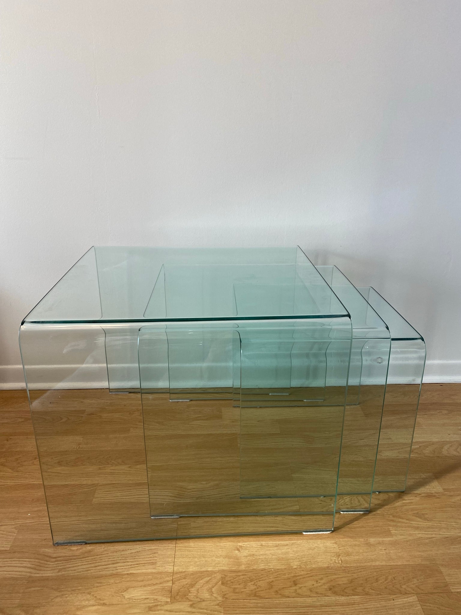 Trio of large tempered glass waterfall nesting side tables