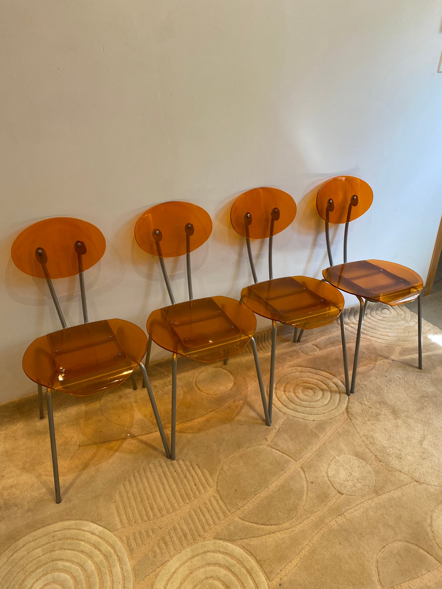 Orange lucite & metal chairs