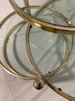 Golden brass & glass round swivel coffee table