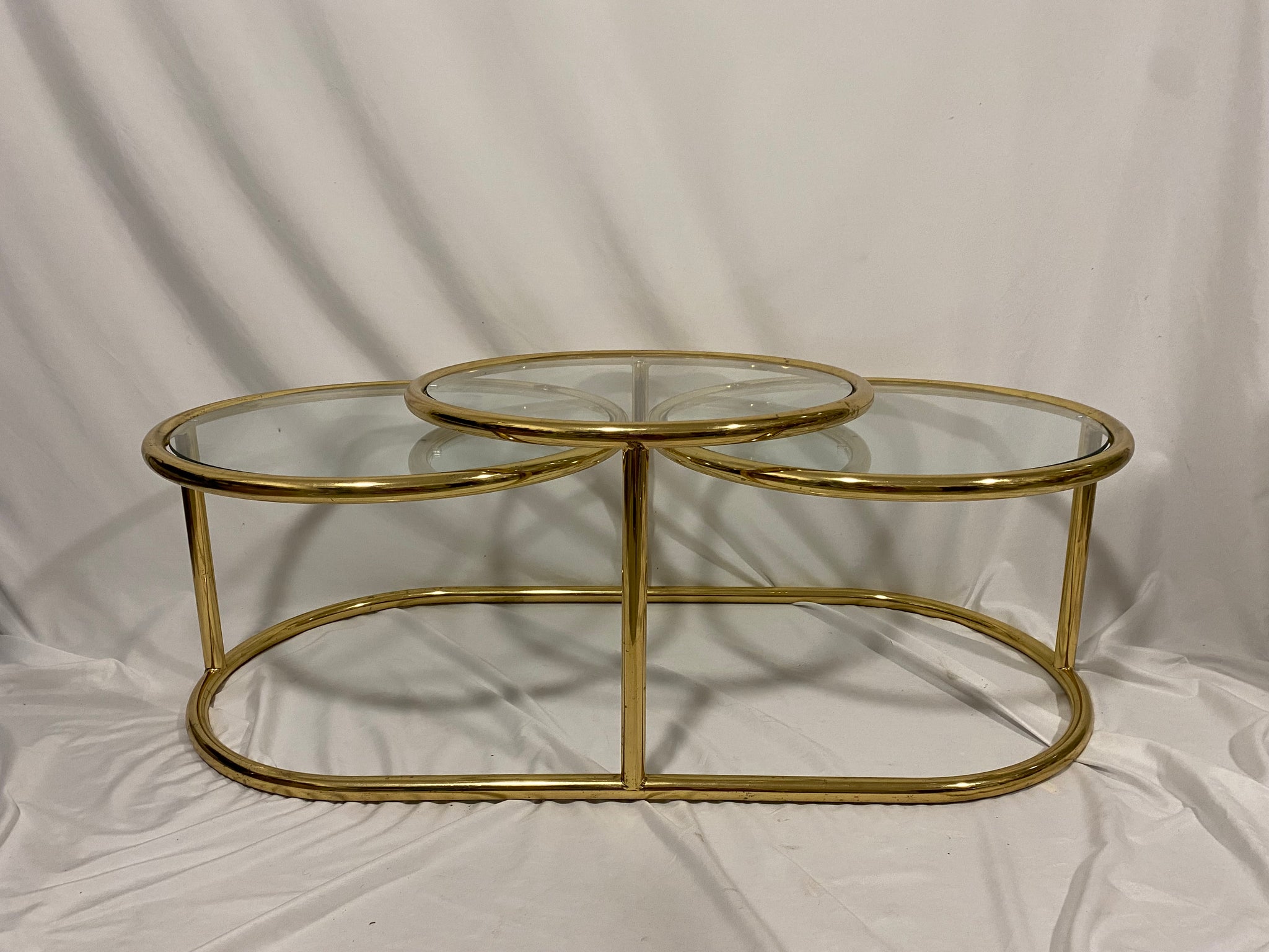 Milo Baughman style golden brass swivel coffee table