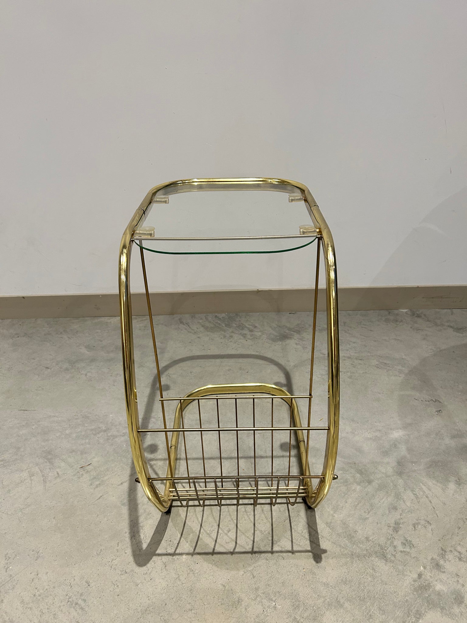 C golden brass side table with literature rack