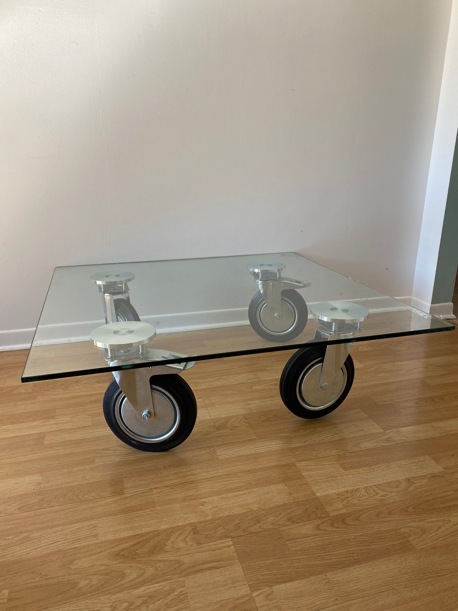 Gae Aulenti Fontana Arte style tempered glass coffee table on wheels